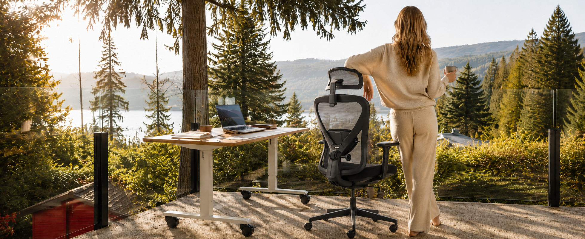 VALKYRIE ergonomic chair beside a standing desk in a woodland workspace